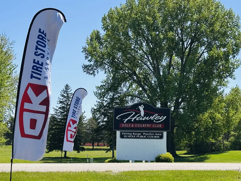 OK Tire banners at Hawley Country Club